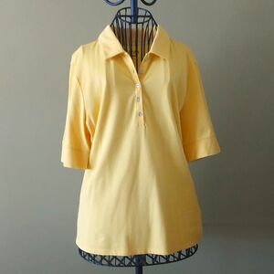 "IZOD", size L, Cool-Fix polo shirt, 49% Cotton. 46% Polyester, 5% Spandex.